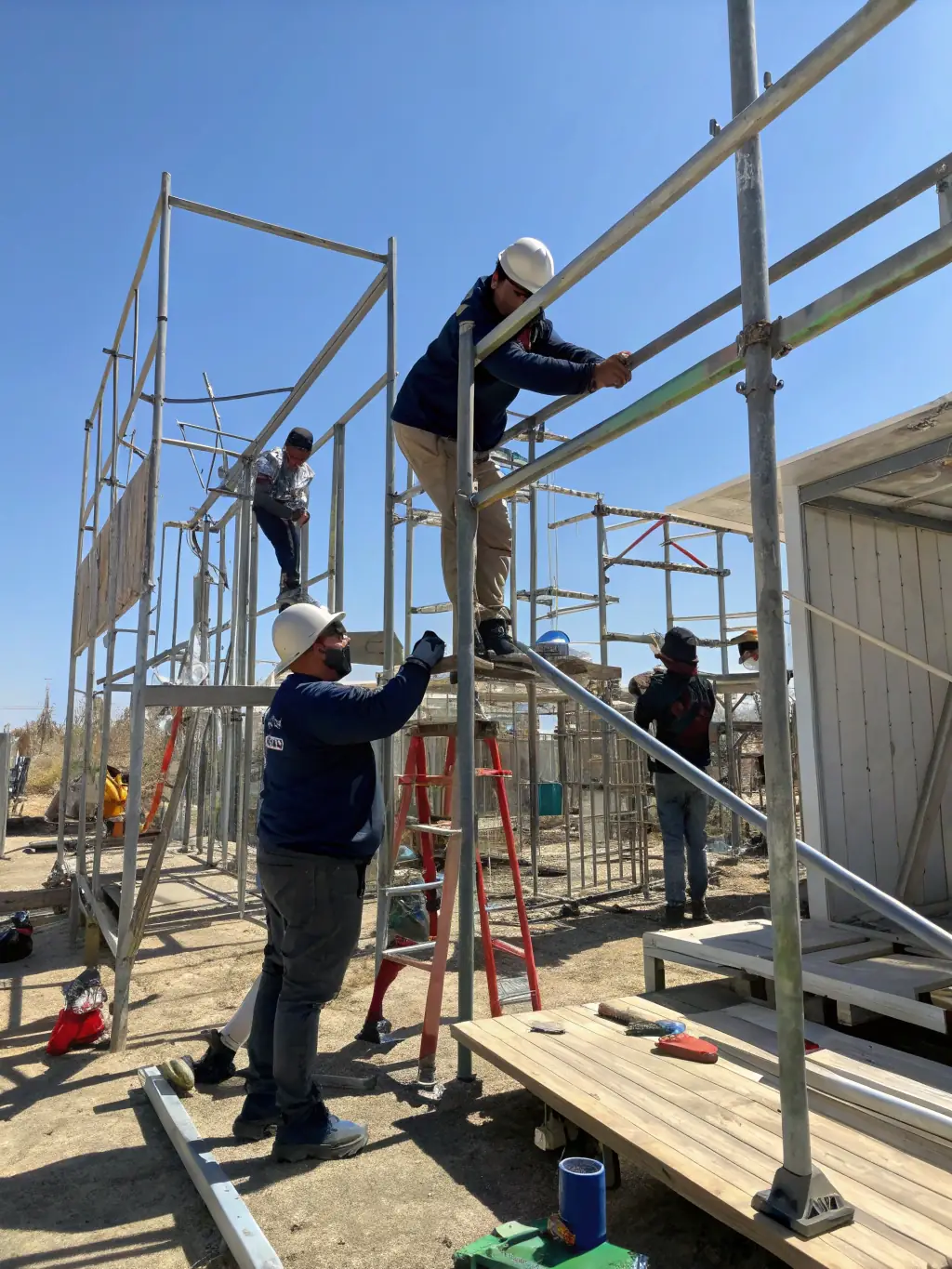 A photograph of Maqtec's certified technicians assembling scaffolding at a construction site, showcasing their expertise and adherence to safety standards.